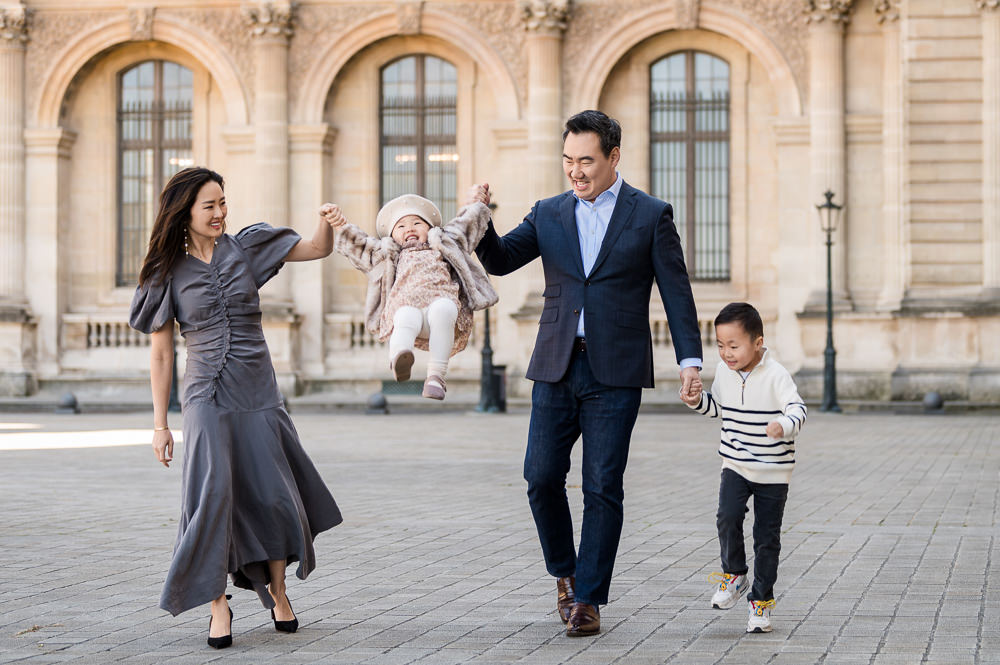 Cute family having fun during their Paris photo shoot with the best Paris photographer - The Paris Photographer
