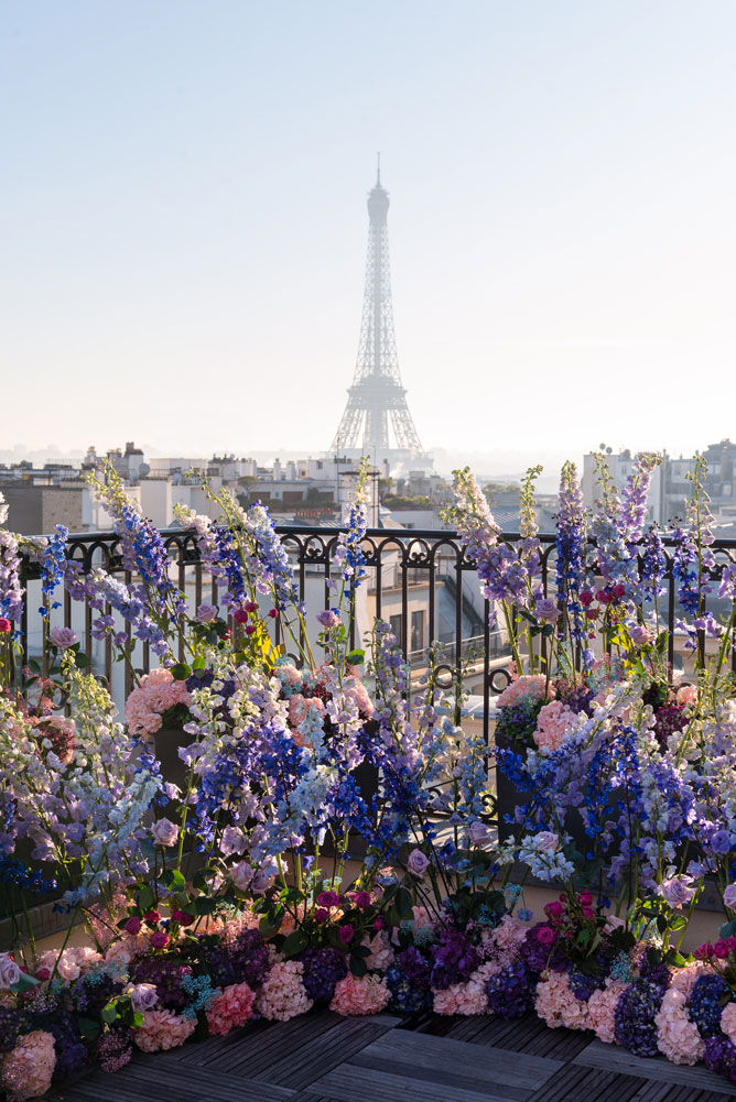 Elopement ceremony setup with flowers and Eiffel Tower view