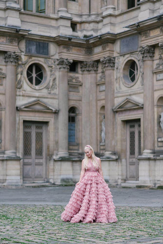 family in paris couture dress at louvre museum