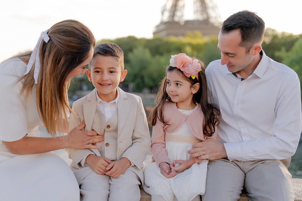 Family with 2 little kids preparing for photos in Paris with The Paris Photographer