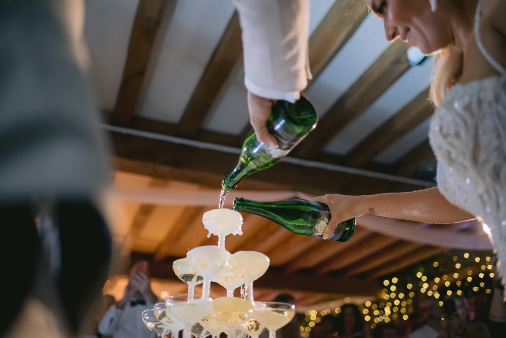 French wedding tradition the champagne pyramid being filled by the newly weds