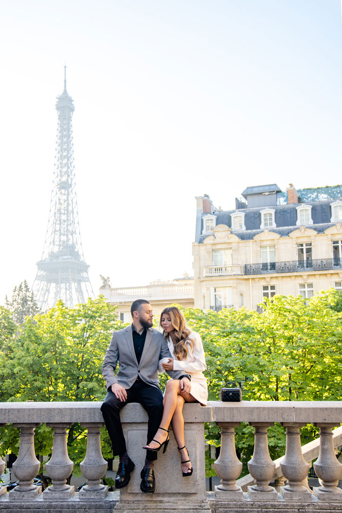 sitting couple pose during couple photoshoot in Paris