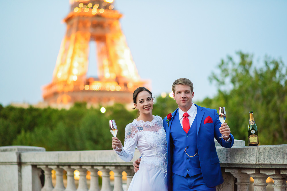 Paris elopement celebration with champagne at the eiffel tower at sunset
