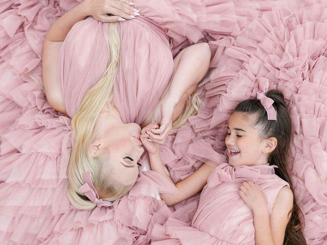Mother and daughter posing fashion in Paris