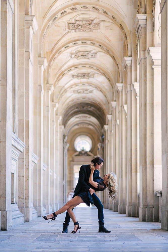 man and woman dancing on the streets of Paris