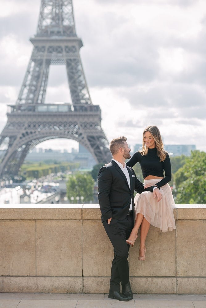 Paris photography - romantic picture of a couple in love at the Eiffel Tower in Paris, France