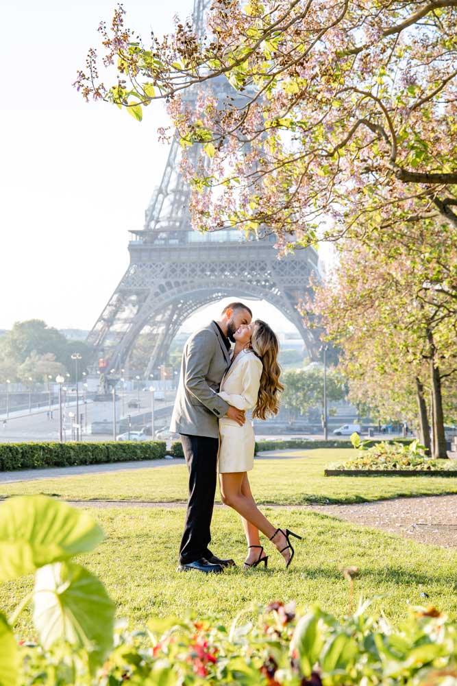 Paris proposal with Eiffel tower under blossom arch
