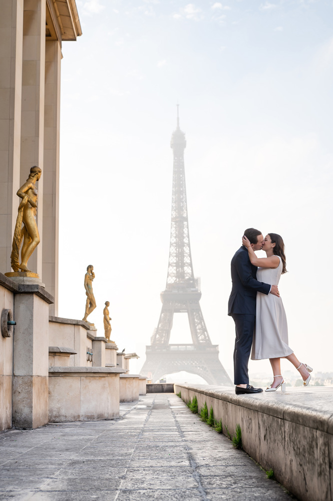 The after Yes kiss with Eiffel Tower silhouette and stautues spectators