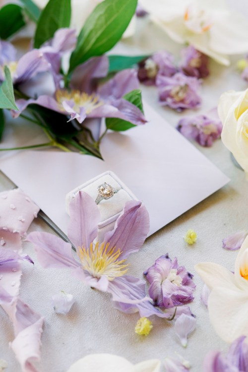 Purple flowers and engagement ring