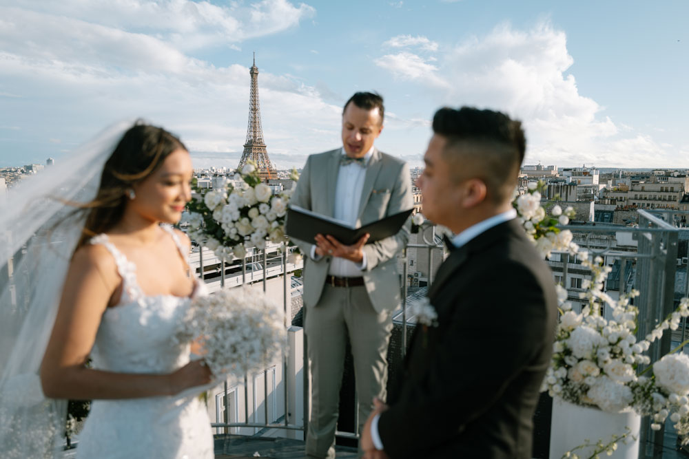 Couple during elopement in Paris, on a rooftop indoor location