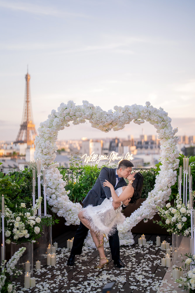 Surprise marriage proposal at the peninsula paris with giant white heart of flowers