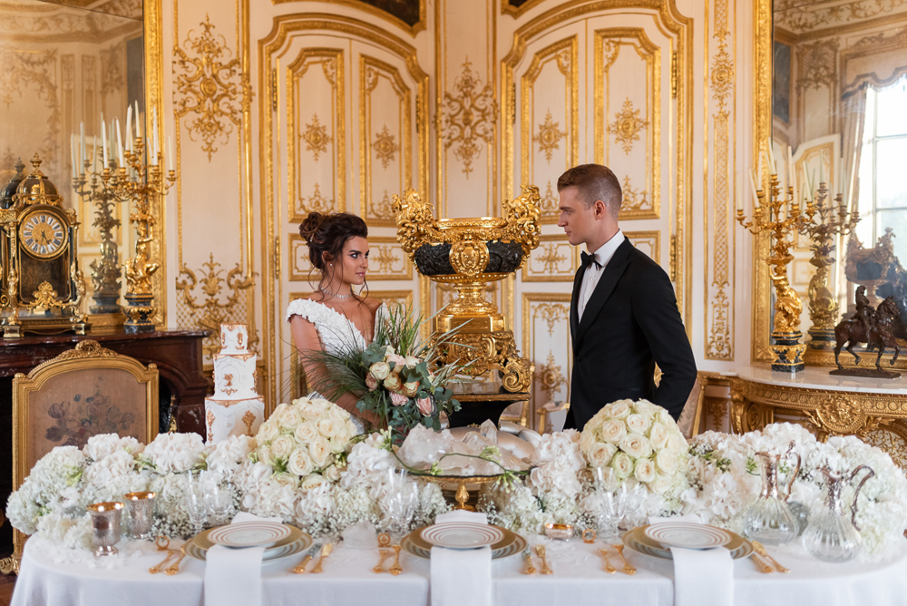 Wedding in France - Bride and groom looking at each other in their French wedding reception venue: Chateau de Chantilly